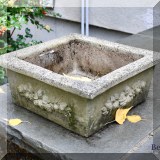 L04. One of a pair of square concrete planters. 